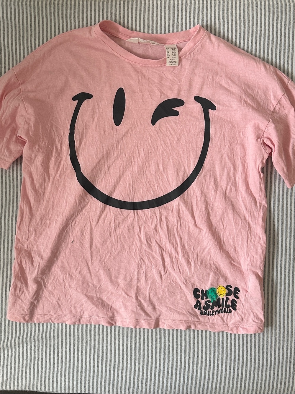 H&M x Smiley World Pink Tee with Black Winking Smiley Graphic